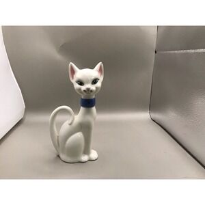Pretty White Porcelain Kitty With Green Eyes And A Blue Collar